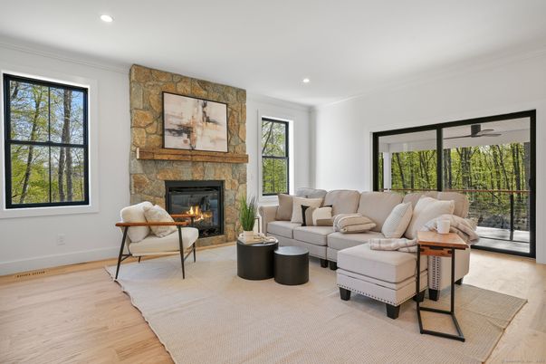 Fireplace, Interior, Living room, Recessed Lighting, Stone Walls, Wood Texture Flooring