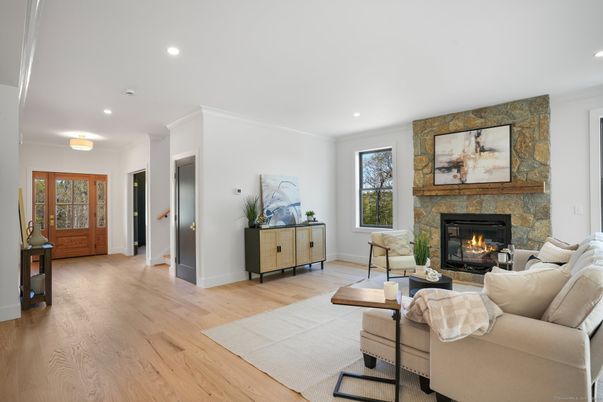 Fireplace, Interior, Living room, Recessed Lighting, Stone Walls, Wood Texture Flooring