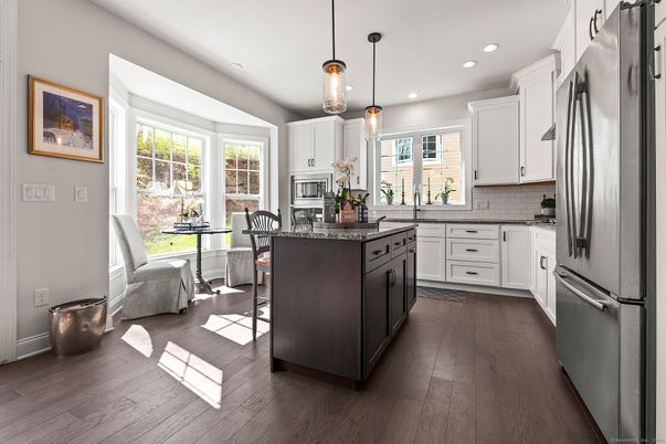 Dining room, Interior, Kitchen, Pendant Lights, Recessed Lighting, Stainless Steel Appliances, Wood Texture Flooring