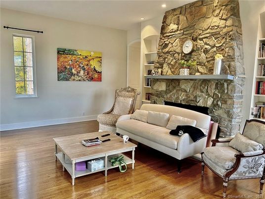 Fireplace, Interior, Living room, Recessed Lighting, Stone Walls, Wood Texture Flooring