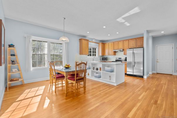 Dining room, Interior, Kitchen, Pendant Lights, Recessed Lighting, Stainless Steel Appliances, Wood Texture Flooring