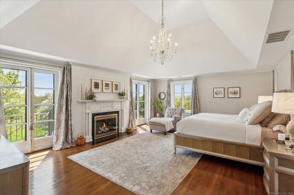 Bedroom, Chandelier, Fireplace, Interior, Wood Texture Flooring