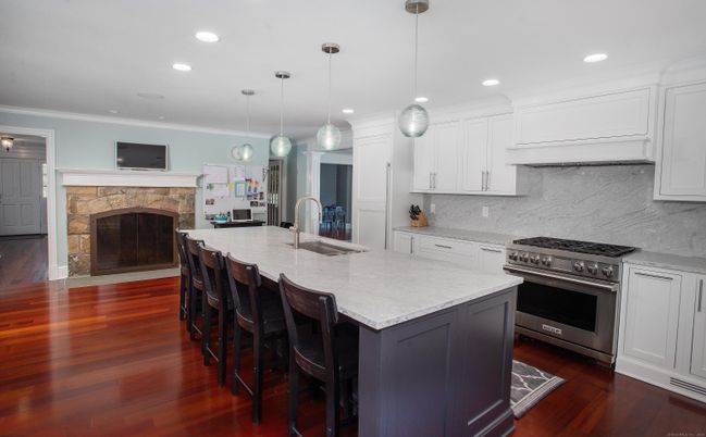 Fireplace, Interior, Kitchen, Pendant Lights, Recessed Lighting, Stainless Steel Appliances, Wood Texture Flooring