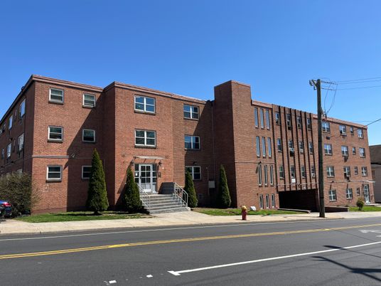 Exterior, Facade, Brick Facade, Condo Building