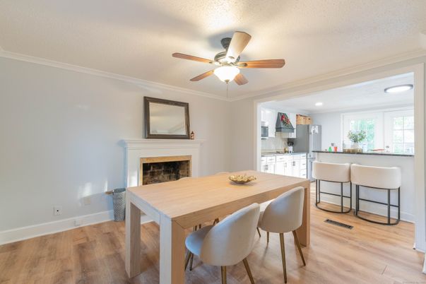 Dining room, Fireplace, Interior, Kitchen, Recessed Lighting, Wood Texture Flooring