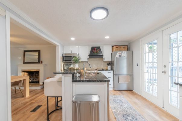Fireplace, Interior, Kitchen, Recessed Lighting, Stainless Steel Appliances, Wood Texture Flooring