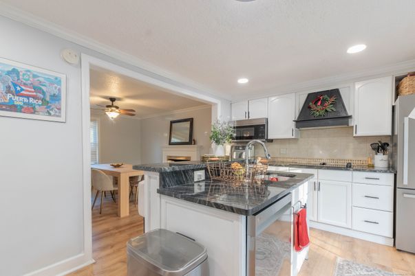 Dining room, Interior, Kitchen, Recessed Lighting, Stainless Steel Appliances, Wood Texture Flooring