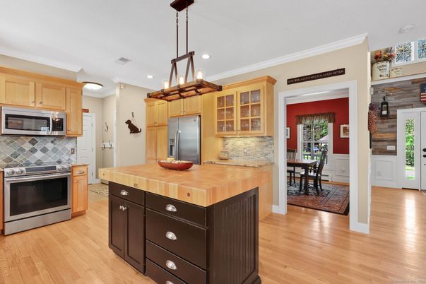 Dining room, Interior, Kitchen, Pendant Lights, Recessed Lighting, Stainless Steel Appliances, Wood Texture Flooring
