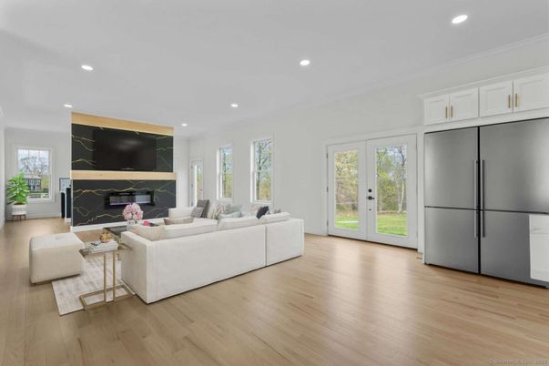 Fireplace, Interior, Living room, Marble Walls, Recessed Lighting, Wood Texture Flooring