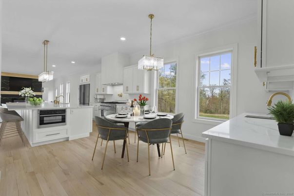 Chandelier, Dining room, Interior, Kitchen, Pendant Lights, Recessed Lighting, Stainless Steel Appliances, Wood Texture Flooring