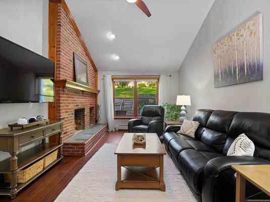 Fireplace, Interior, Living room, Recessed Lighting, Stone Walls, Wood Texture Flooring
