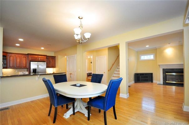 Chandelier, Dining room, Fireplace, Interior, Kitchen, Recessed Lighting, Stainless Steel Appliances, Wood Texture Flooring