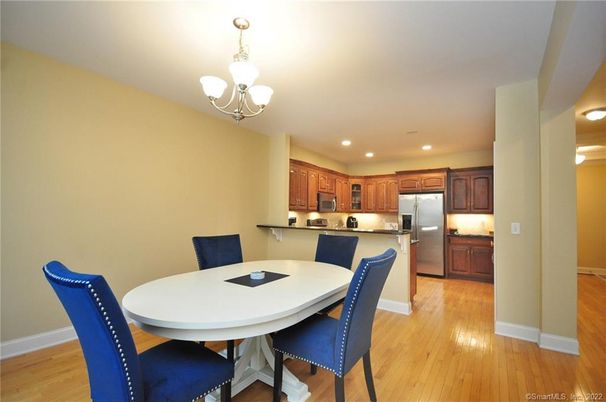 Chandelier, Dining room, Interior, Kitchen, Recessed Lighting, Stainless Steel Appliances, Wood Texture Flooring