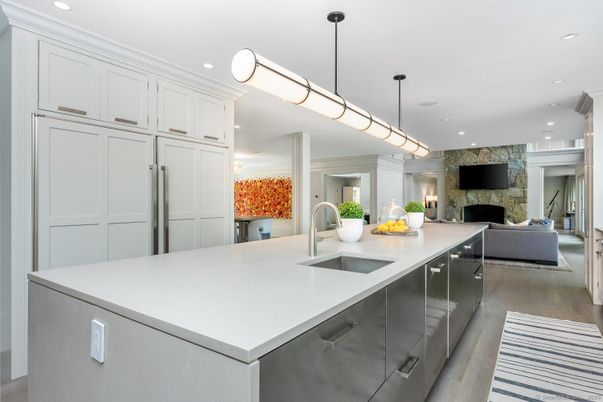 Fireplace, Interior, Kitchen, Living room, Pendant Lights, Recessed Lighting, Stainless Steel Appliances, Stone Walls, Wood Texture Flooring