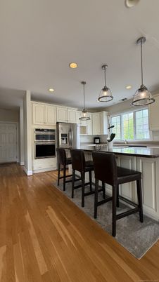Interior, Kitchen, Pendant Lights, Recessed Lighting, Stainless Steel Appliances, Wood Texture Flooring