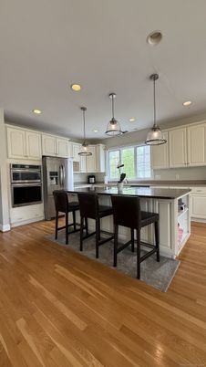 Dining room, Interior, Kitchen, Pendant Lights, Recessed Lighting, Stainless Steel Appliances, Wood Texture Flooring