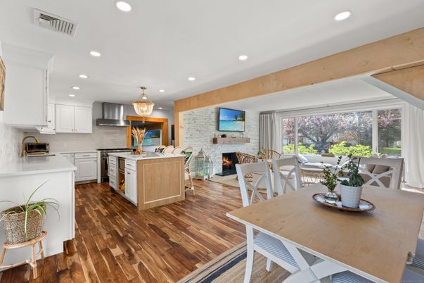 Dining room, Fireplace, Interior, Kitchen, Pendant Lights, Recessed Lighting, Stainless Steel Appliances, Stone Walls, Wood Texture Flooring