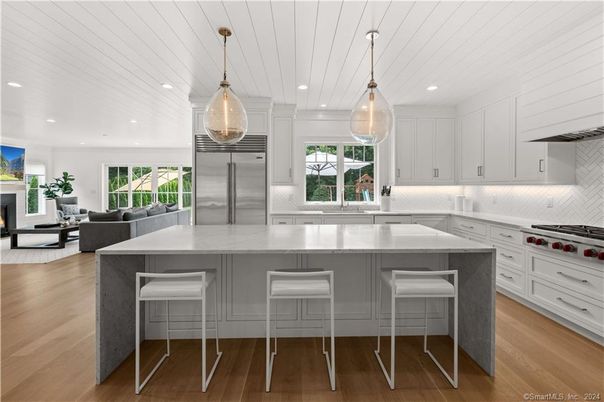 Fireplace, Interior, Kitchen, Living room, Pendant Lights, Recessed Lighting, Stainless Steel Appliances, Wood Texture Flooring