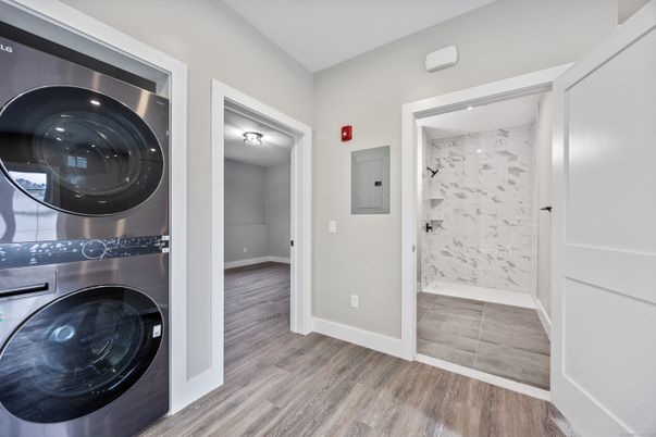 Bathroom, Interior, Marble Walls, Utility Closets, Washer, Wood Texture Flooring