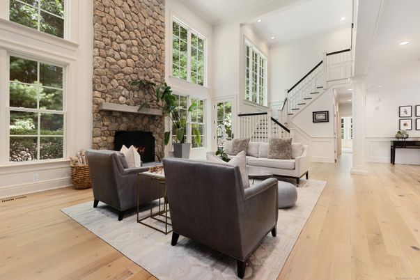Fireplace, Interior, Living room, Recessed Lighting, Stone Walls, Wood Texture Flooring