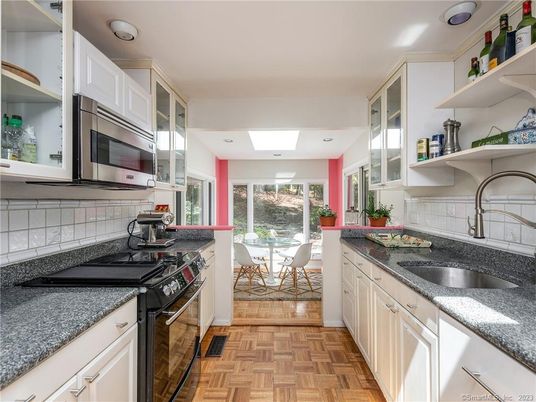 Dining room, Interior, Kitchen, Recessed Lighting, Stainless Steel Appliances, Wood Texture Flooring