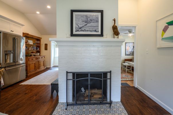 Fireplace, Interior, Kitchen, Recessed Lighting, Stainless Steel Appliances, Wood Texture Flooring