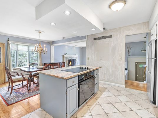 Chandelier, Dining room, Fireplace, Interior, Kitchen, Recessed Lighting, Wood Texture Flooring