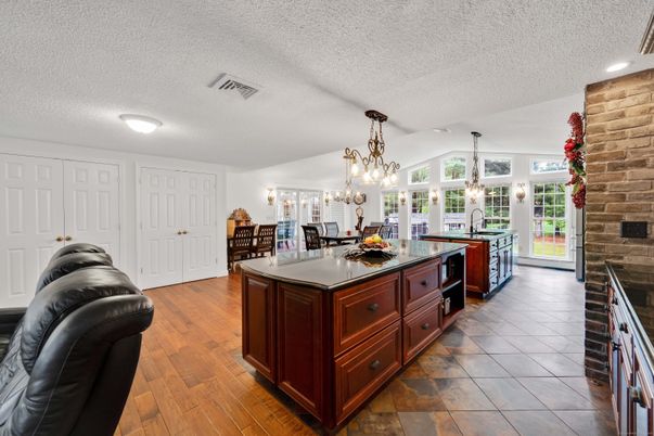 Chandelier, Dining room, Interior, Kitchen, Recessed Lighting, Stone Walls, Wood Texture Flooring