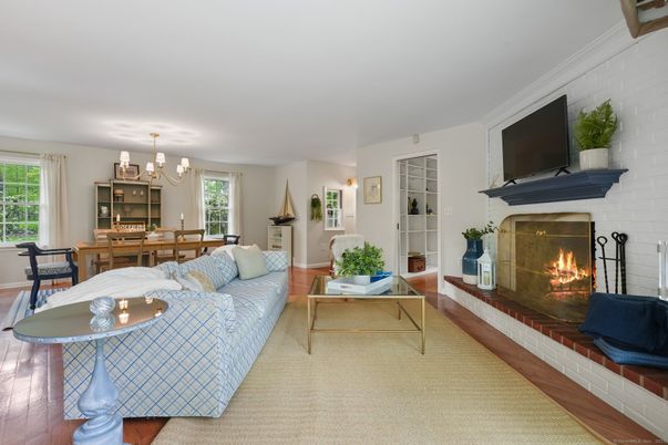 Chandelier, Dining room, Fireplace, Interior, Living room, Stone Walls, Wood Texture Flooring