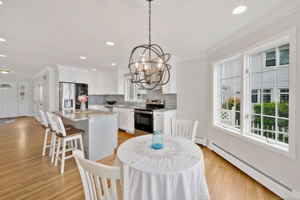 Chandelier, Dining room, Interior, Kitchen, Pendant Lights, Recessed Lighting, Stainless Steel Appliances, Wood Texture Flooring
