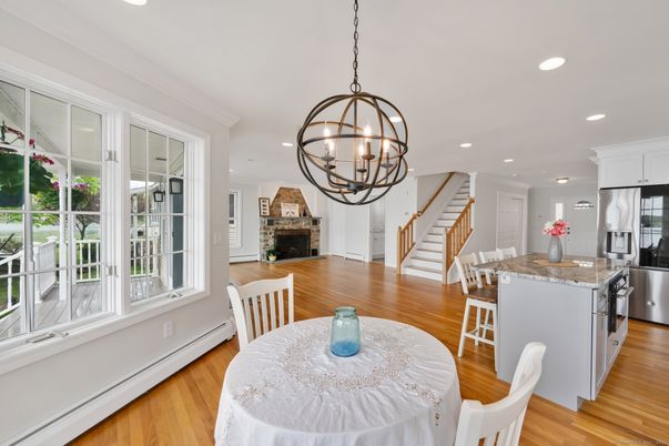Chandelier, Dining room, Fireplace, Interior, Kitchen, Pendant Lights, Recessed Lighting, Stainless Steel Appliances, Wood Texture Flooring