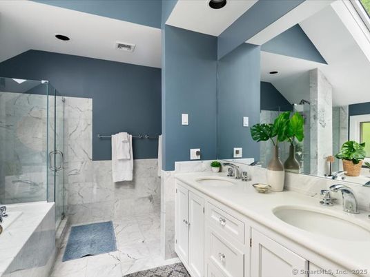 Bathroom, Dual Sink Vanities, Glass Shower, Interior, Marble, Marble Walls, Recessed Lighting