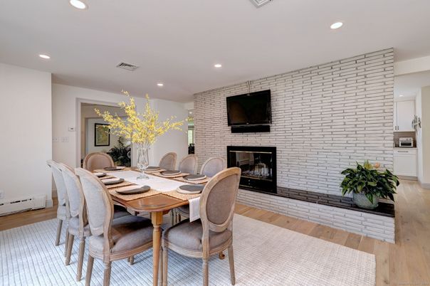 Dining room, Fireplace, Interior, Recessed Lighting, Stone Walls, Wood Texture Flooring