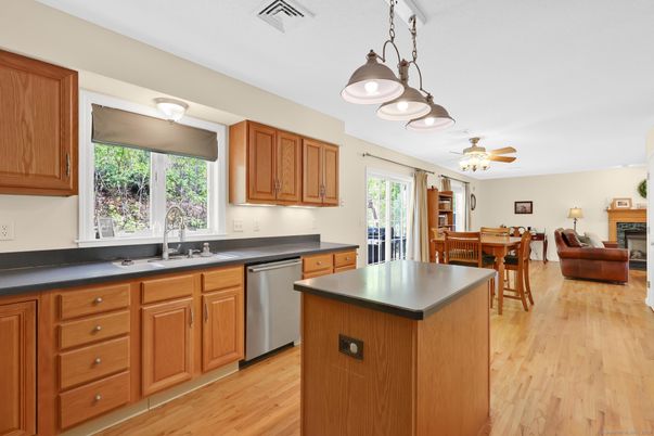 Dining room, Fireplace, Interior, Kitchen, Stainless Steel Appliances, Wood Texture Flooring