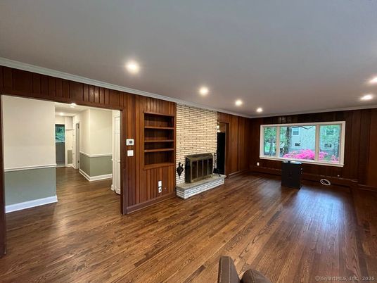 Empty room, Fireplace, Interior, Recessed Lighting, Stone Walls, Wood Texture Flooring, Wooden Walls