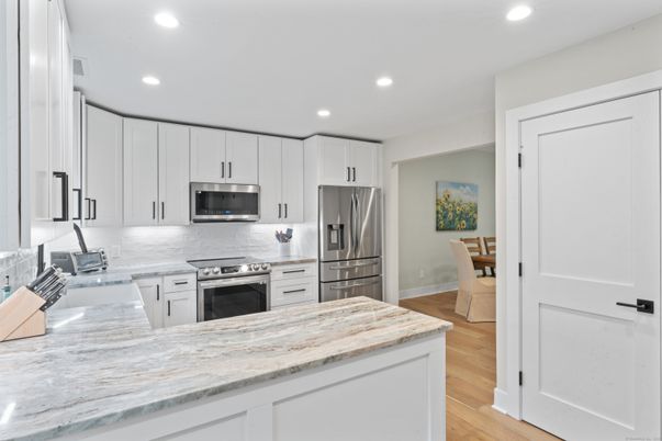 Interior, Kitchen, Recessed Lighting, Stainless Steel Appliances, Wood Texture Flooring