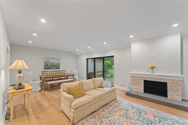 Dining room, Fireplace, Interior, Living room, Recessed Lighting, Wood Texture Flooring