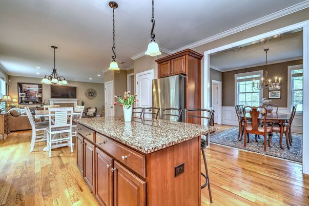Chandelier, Dining room, Interior, Kitchen, Living room, Pendant Lights, Recessed Lighting, Stainless Steel Appliances, Wood Texture Flooring
