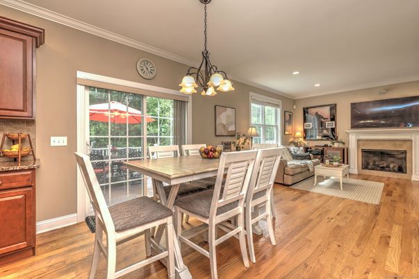 Chandelier, Dining room, Fireplace, Interior, Living room, Pendant Lights, Recessed Lighting, Wood Texture Flooring