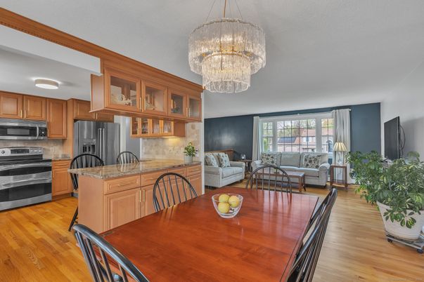 Chandelier, Dining room, Interior, Kitchen, Living room, Stainless Steel Appliances, Wood Texture Flooring