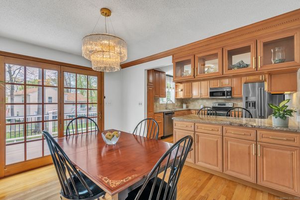 Chandelier, Dining room, Interior, Kitchen, Stainless Steel Appliances, Wood Texture Flooring