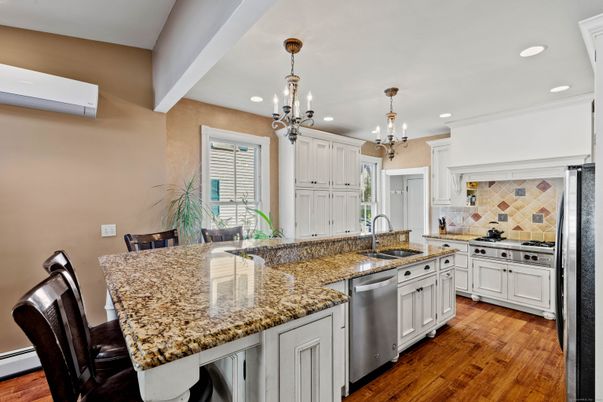 Chandelier, Interior, Kitchen, Pendant Lights, Recessed Lighting, Stainless Steel Appliances, Wood Texture Flooring
