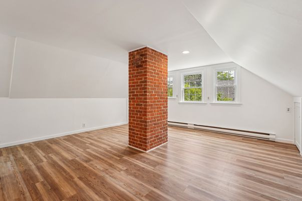 Empty room, Fireplace, Interior, Recessed Lighting, Stone Walls, Wood Texture Flooring