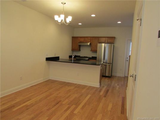 Chandelier, Interior, Kitchen, Recessed Lighting, Stainless Steel Appliances, Wood Texture Flooring