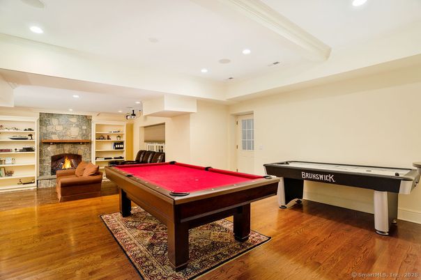 Billiard Table, Fireplace, Game Room, Interior, Recessed Lighting, Stone Walls, Wood Texture Flooring