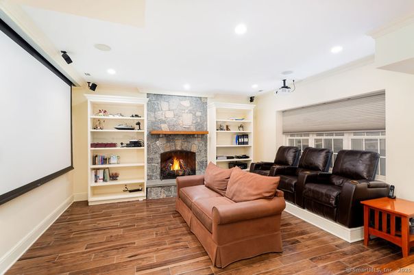 Fireplace, Interior, Living room, Recessed Lighting, Stone Walls, Wood Texture Flooring