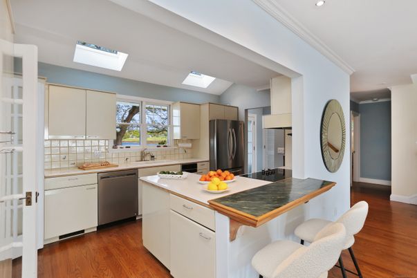 Interior, Kitchen, Recessed Lighting, Stainless Steel Appliances, Tile Countertops, Wood Texture Flooring
