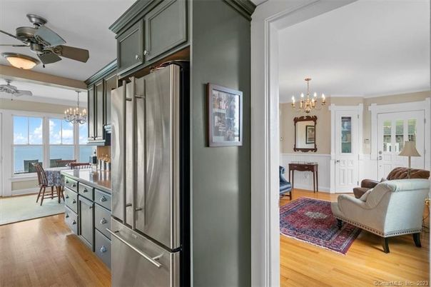 Chandelier, Dining room, Interior, Kitchen, Living room, Pendant Lights, Stainless Steel Appliances, Water, Wood Texture Flooring