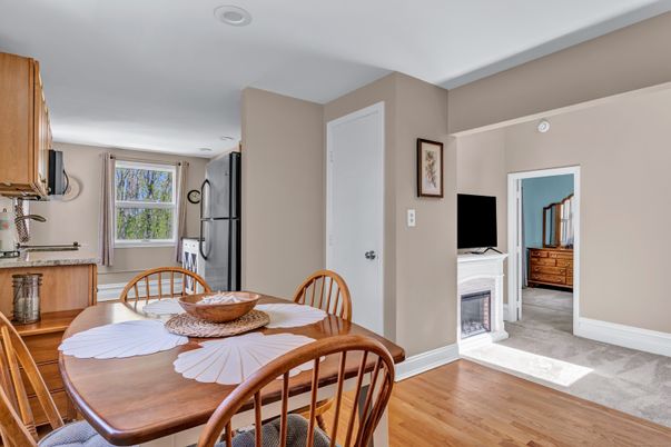 Dining room, Fireplace, Interior, Kitchen, Recessed Lighting, Wood Texture Flooring