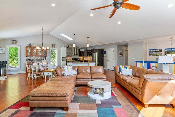 Chandelier, Dining room, Interior, Kitchen, Living room, Pendant Lights, Recessed Lighting, Stainless Steel Appliances, Wood Texture Flooring